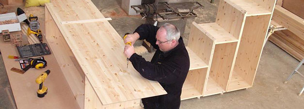 Bespoke Carpentry and Joinery - Stuart working on shelving